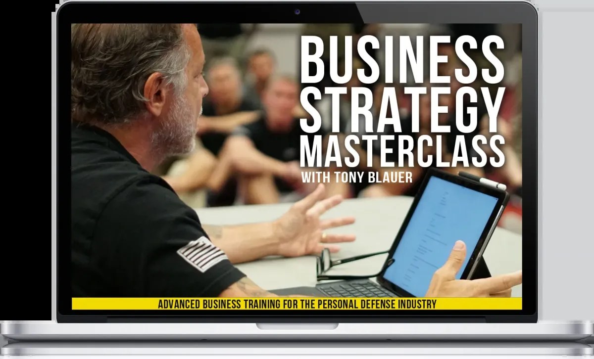 The Self-Defense Entrepreneur — Digital Masterclass training portal on a laptop